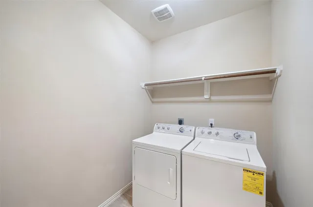 a utility room with dryer and washer