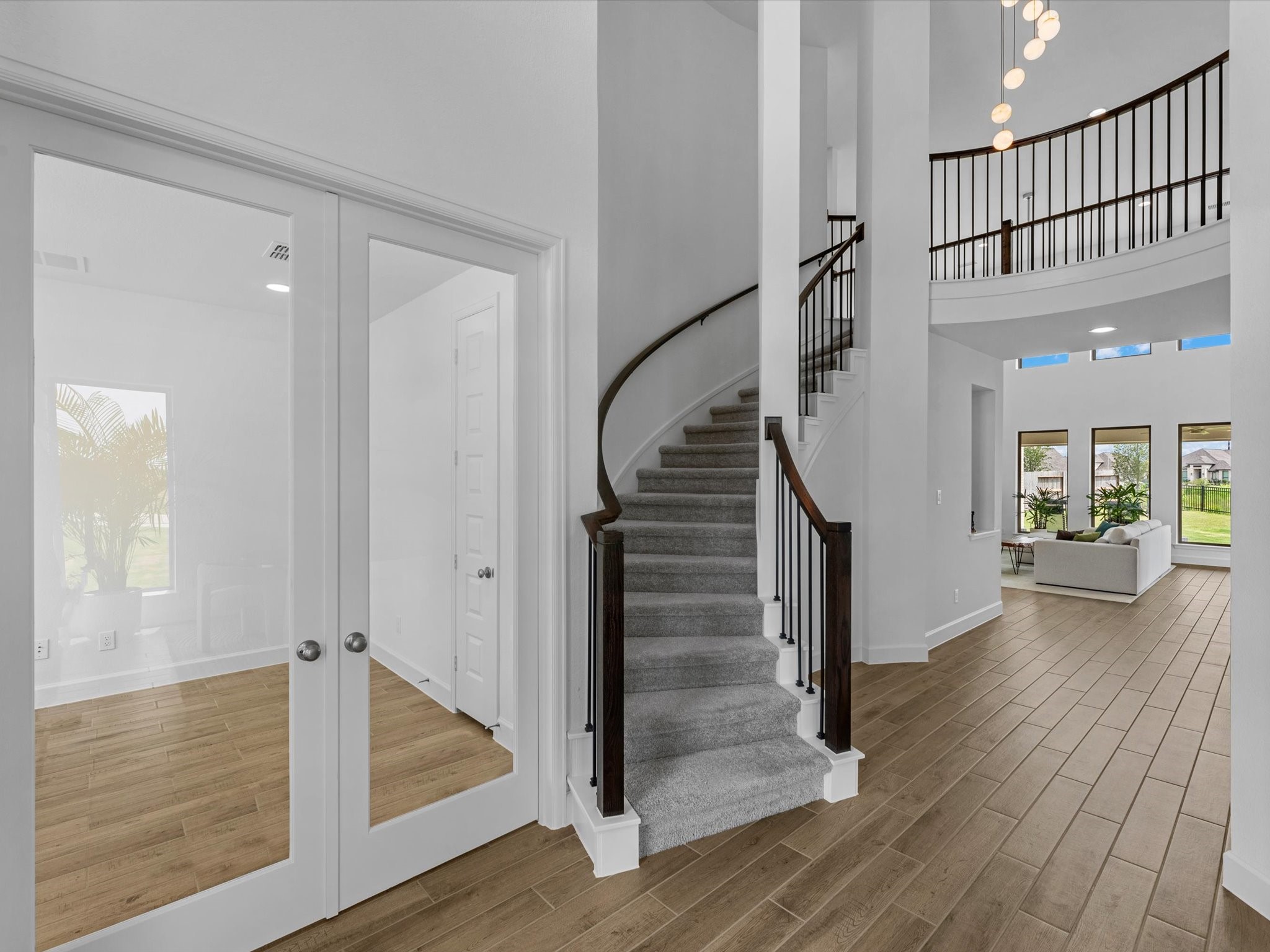 18714 Pistachio Way Manvel, TX 77578 - Photo 26 of 48 As you make your way upstairs, the home's elegant curved staircase once again takes center stage, showcasing the timeless architectural design that defines this Perry Homes masterpiece.