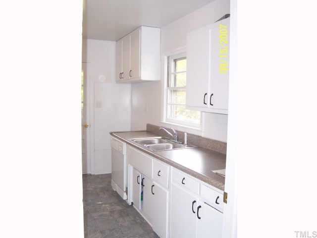 4305 James Road Raleigh, NC 27616 - Photo 2 of 5 a spacious bathroom with a double vanity sink and a mirror