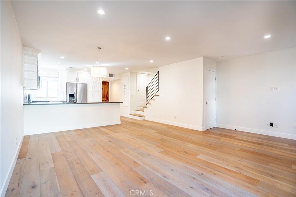 10926 Bluffside Drive, Unit 9 Studio City, CA 91604 - Photo 11 of 43 a view of a kitchen with wooden floor and a sink