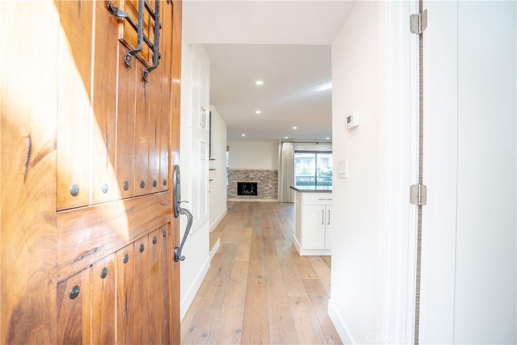 10926 Bluffside Drive, Unit 9 Studio City, CA 91604 - Photo 2 of 43 a view of a hallway with wooden floor and staircase