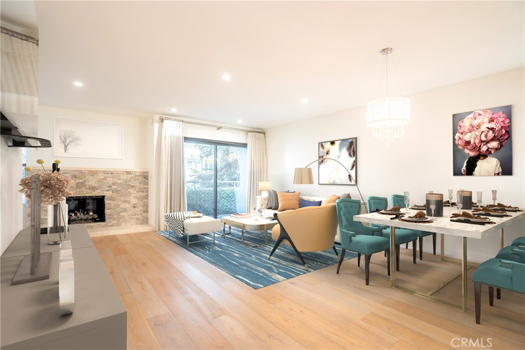 10926 Bluffside Drive, Unit 9 Studio City, CA 91604 - Photo 3 of 43 a living room with furniture a fireplace and a table