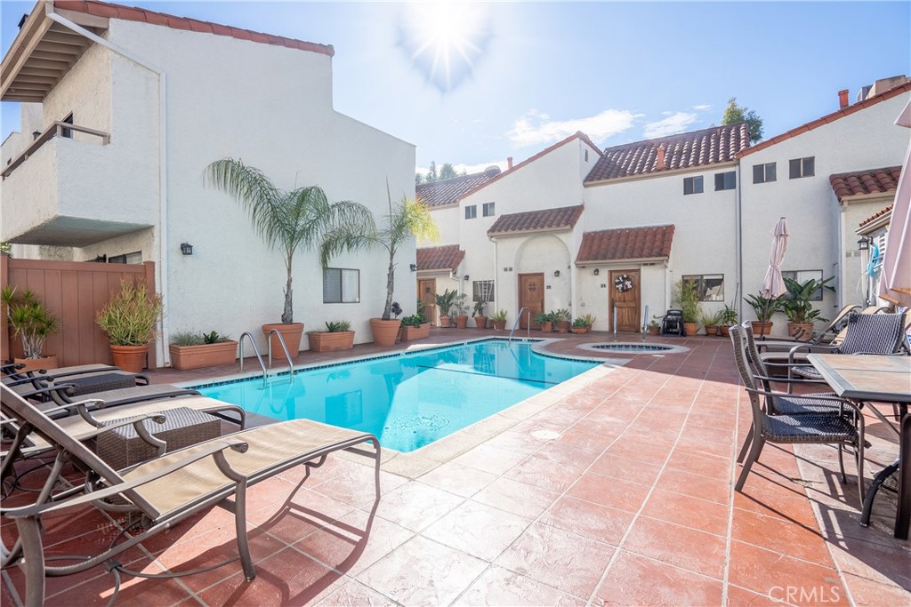 10926 Bluffside Drive, Unit 9 Studio City, CA 91604 - Photo 31 of 43 a view of a house with swimming pool and sitting area