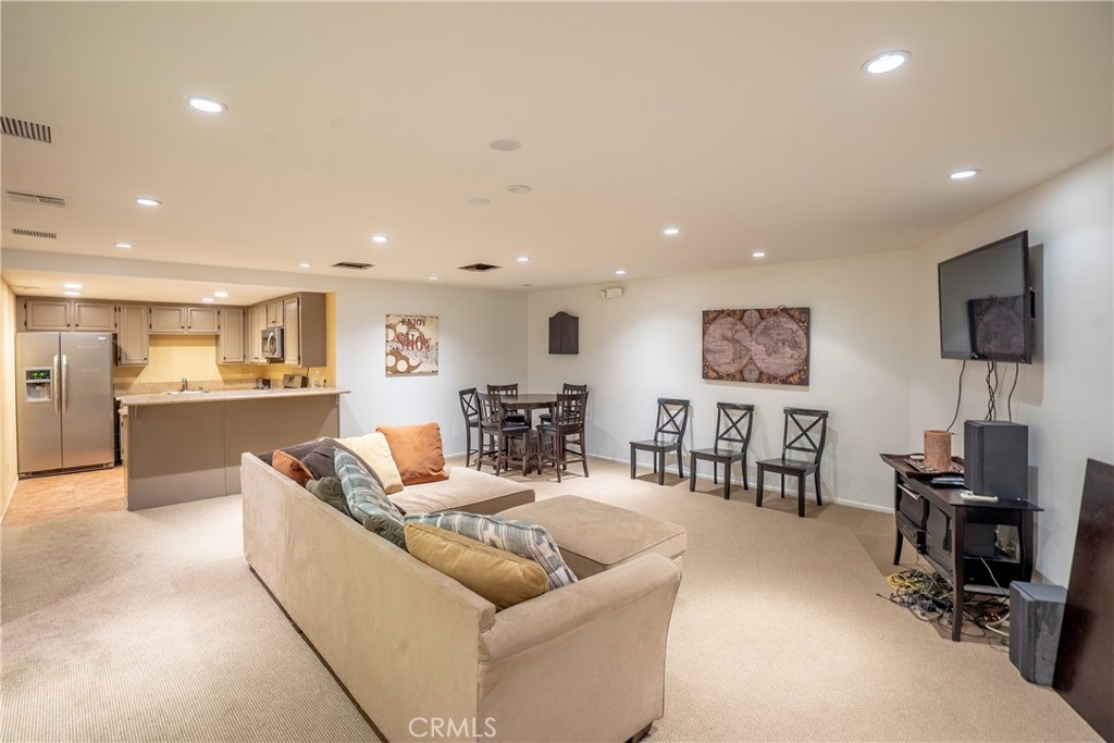 10926 Bluffside Drive, Unit 9 Studio City, CA 91604 - Photo 37 of 43 a living room with furniture and a flat screen tv