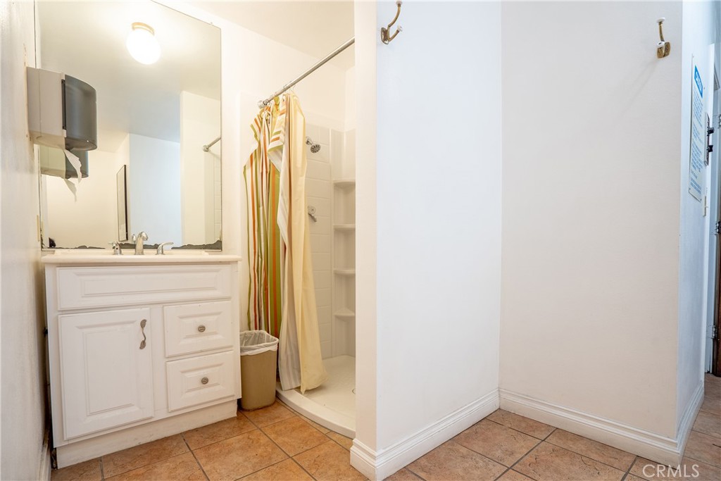 10926 Bluffside Drive, Unit 9 Studio City, CA 91604 - Photo 39 of 43 a bathroom with a double vanity sink and mirror