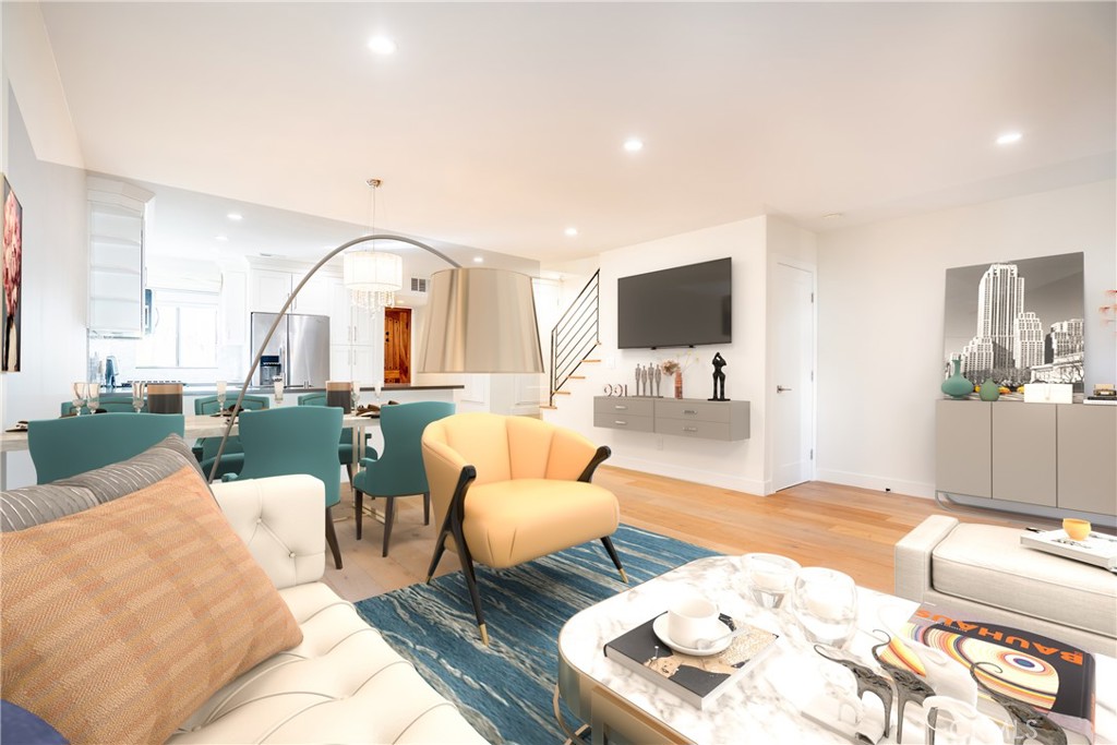 10926 Bluffside Drive, Unit 9 Studio City, CA 91604 - Photo 4 of 43 a living room with furniture and a flat screen tv