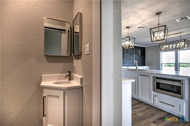 a bathroom with a sink and a mirror