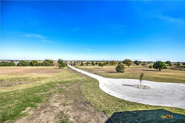 a view of a lake with a big yard