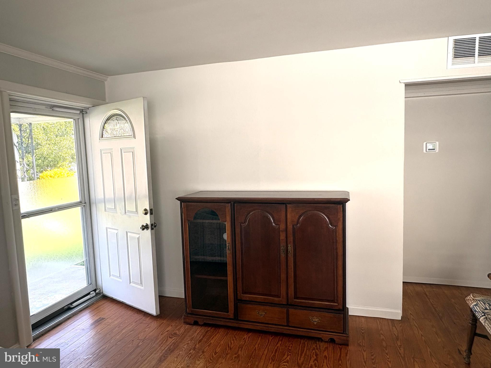115 Compass Road Baltimore, MD 21220 - Photo 7 of 13 a hallway with windows and wooden floor