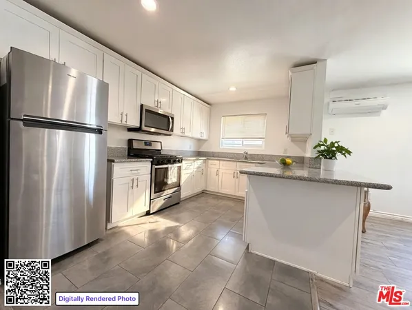 a kitchen with stainless steel appliances granite countertop a refrigerator sink and stove