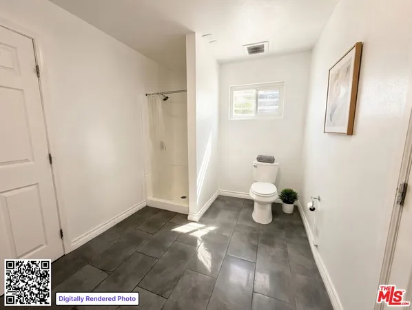 a view of a hallway with toilet