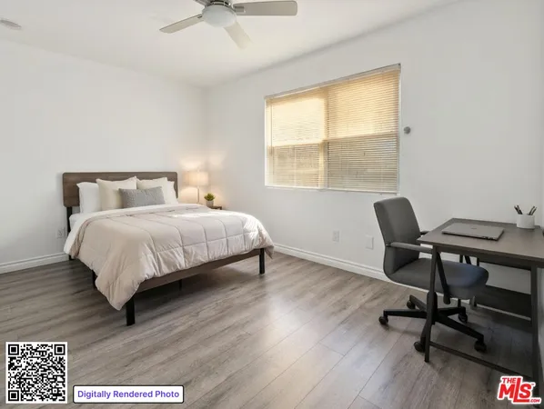 a bedroom with a bed a desk and chair