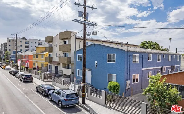 a car parked in front of a brick building