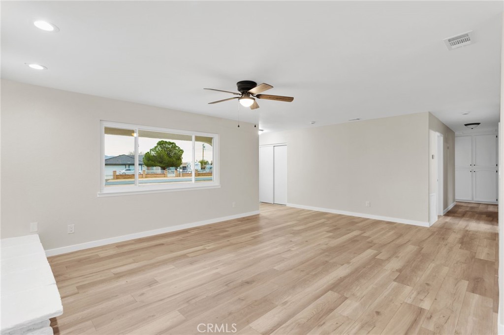 12532 Sholic Road Apple Valley, CA 92308 - Photo 11 of 41 a view of an empty room with a window