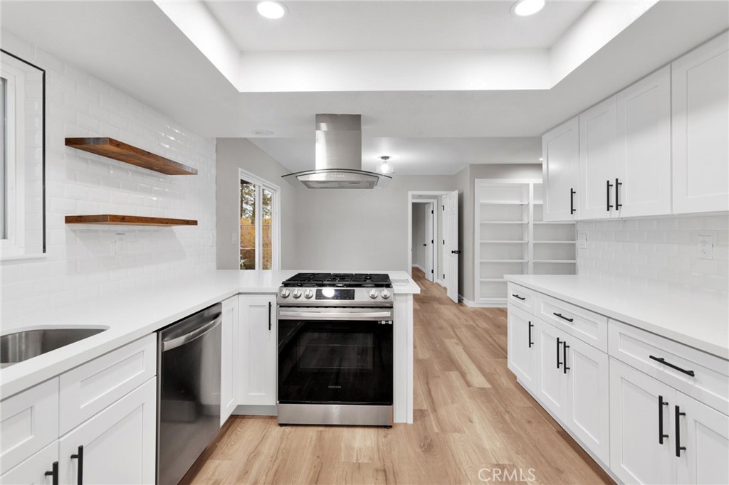12532 Sholic Road Apple Valley, CA 92308 - Photo 18 of 41 a kitchen with a stove oven and sink