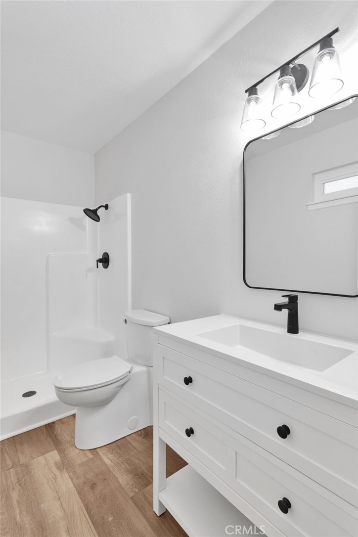 12532 Sholic Road Apple Valley, CA 92308 - Photo 29 of 41 a bathroom with a sink a toilet and shower