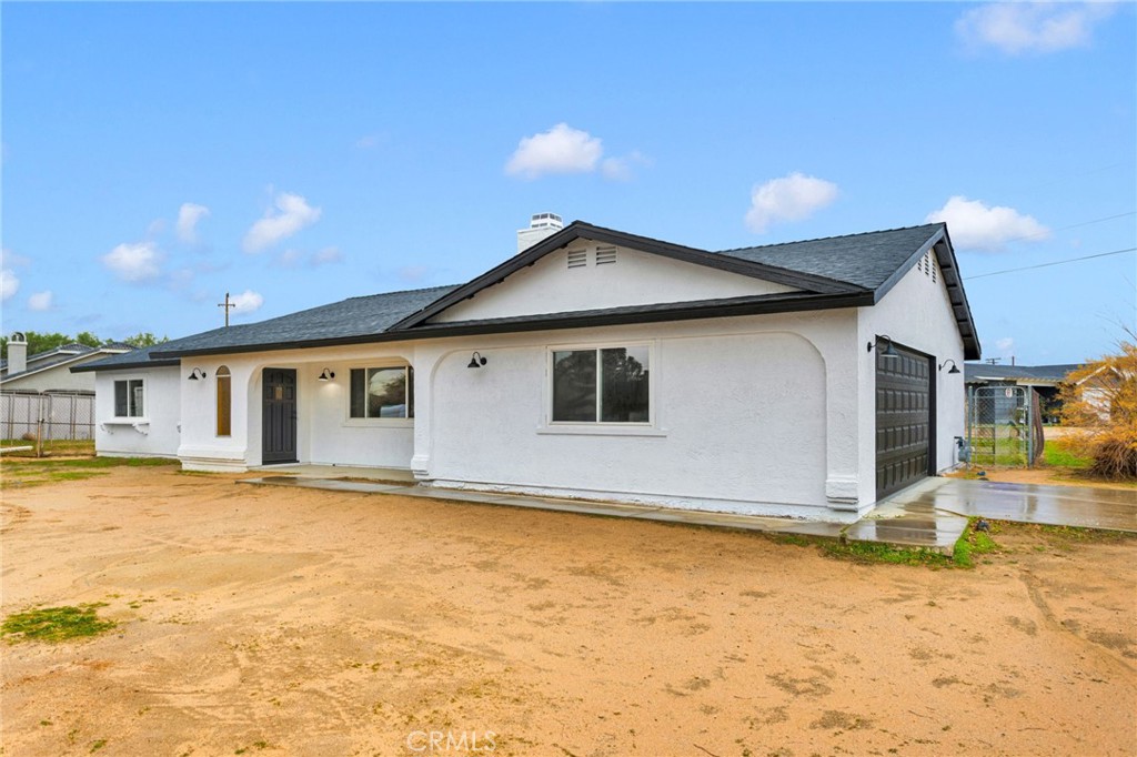 12532 Sholic Road Apple Valley, CA 92308 - Photo 3 of 41 a house with yard in front of it