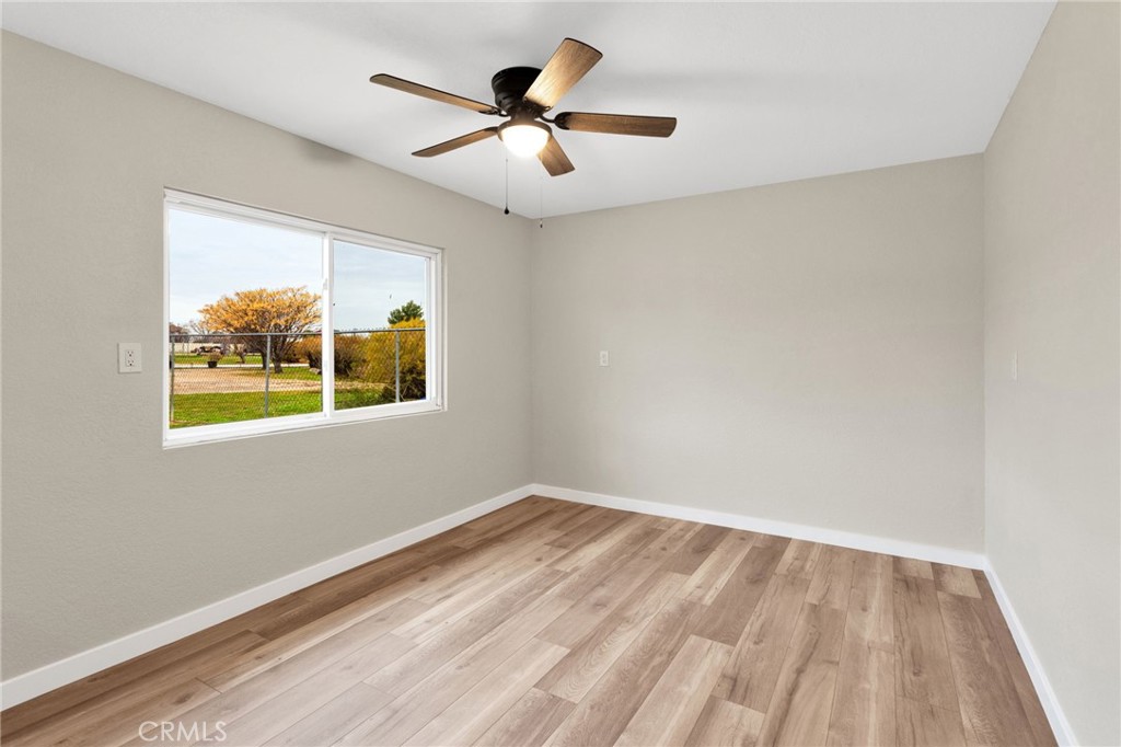 12532 Sholic Road Apple Valley, CA 92308 - Photo 33 of 41 a view of room with window and ceiling fan