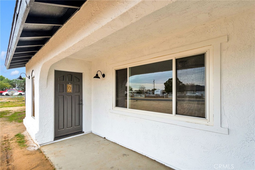 12532 Sholic Road Apple Valley, CA 92308 - Photo 6 of 41 a view of a glass door with a balcony