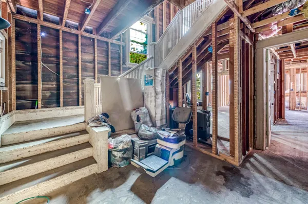 a view of a room with wooden floor and outdoor seating