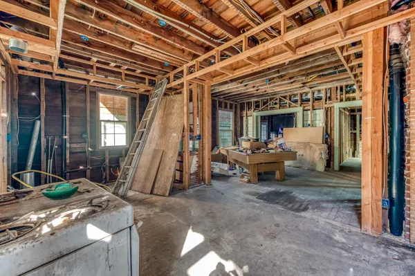a view of a porch with wooden floor and stairs
