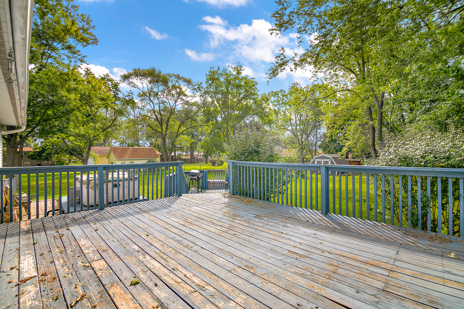 3926 East Chestnut Street Kankakee, IL 60901 - Photo 10 of 14 a balcony with trees in front of it