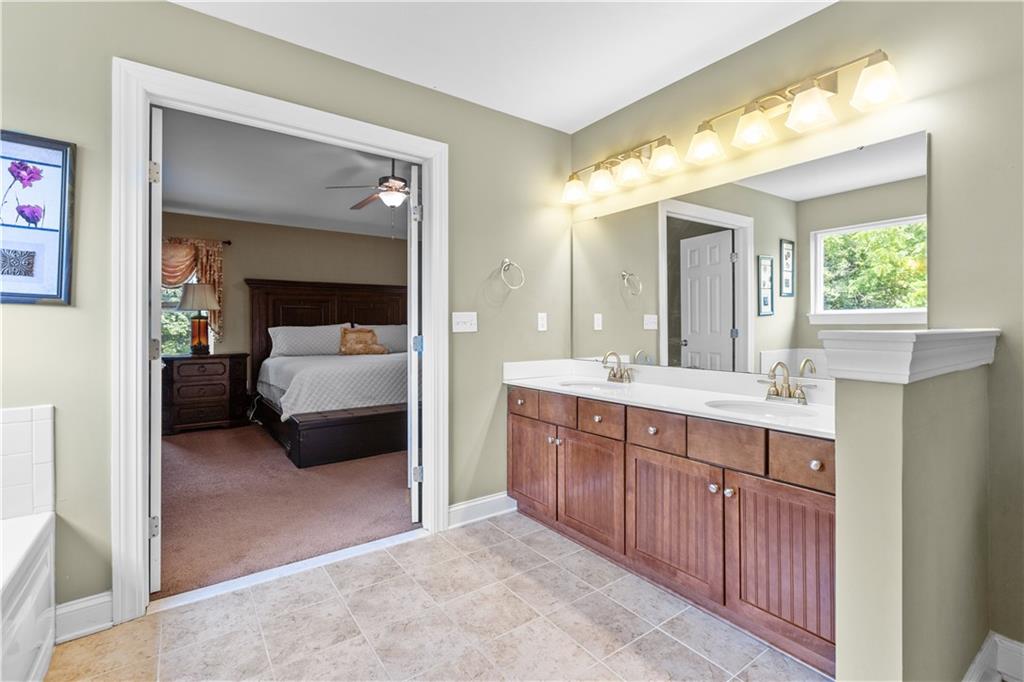 242 Kings Road Washington, PA 15301 - Photo 23 of 42 a en suite bathroom with a double vanity sink and a mirror