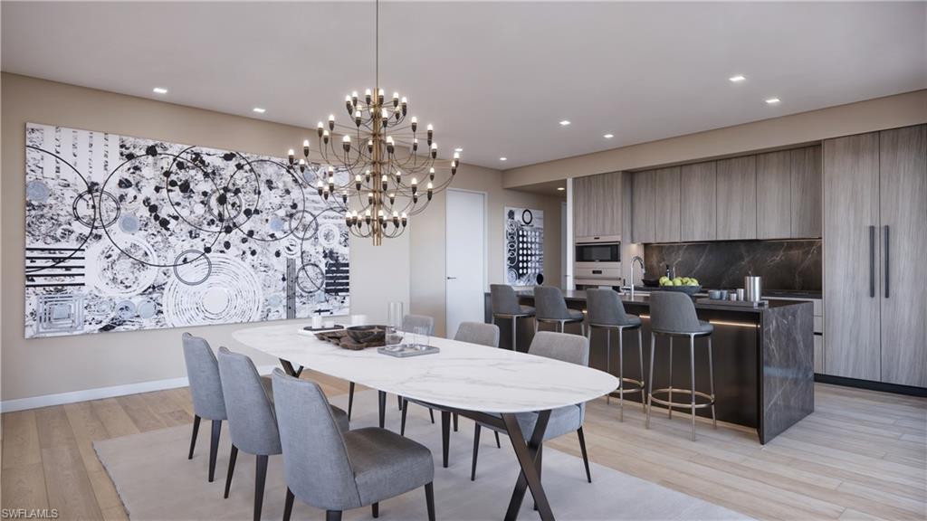 1301 3rd Avenue South, Unit PHW Naples, FL 34102 - Photo 4 of 22 a view of a dining room with furniture and wooden floor