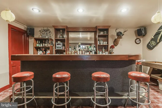 a kitchen with stainless steel appliances kitchen island granite countertop a table and chairs