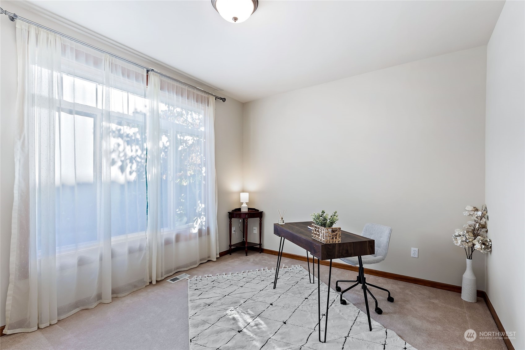 133 185th Place Southwest Bothell, WA 98012 - Photo 16 of 32 a living room with furniture and a window