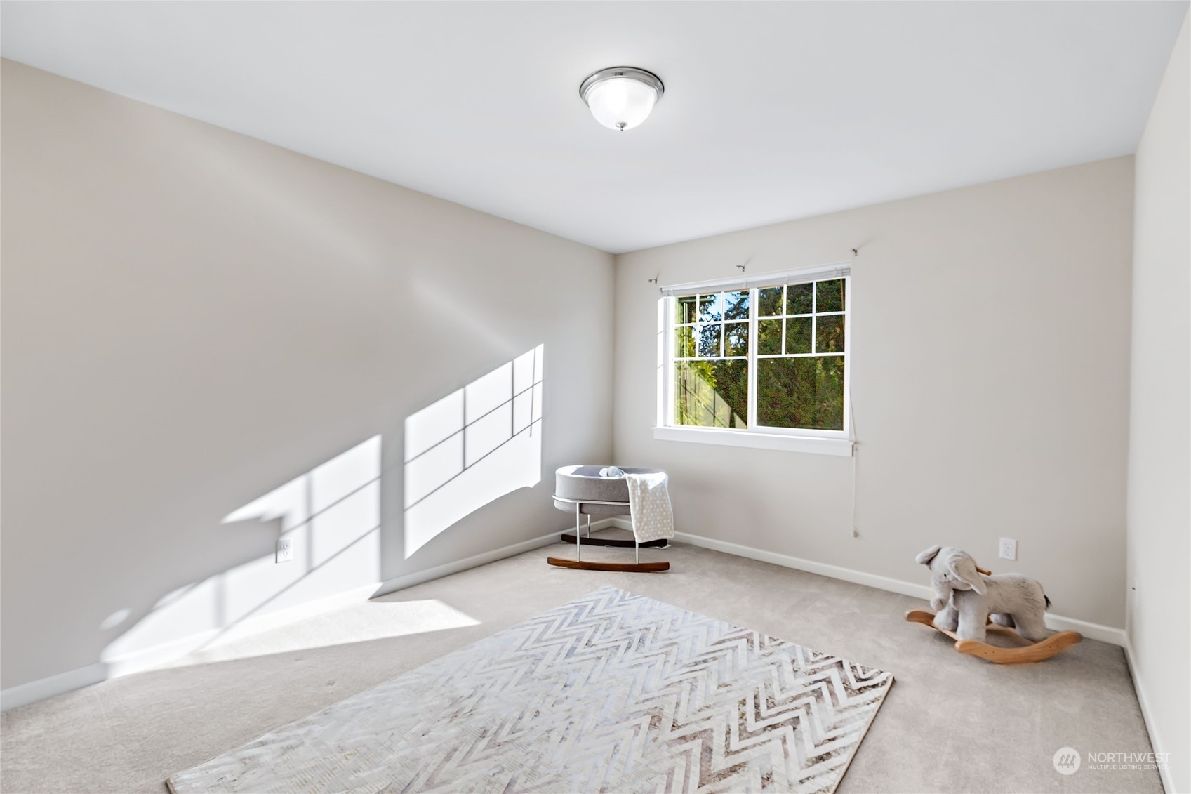 133 185th Place Southwest Bothell, WA 98012 - Photo 27 of 32 a bedroom with furniture and window