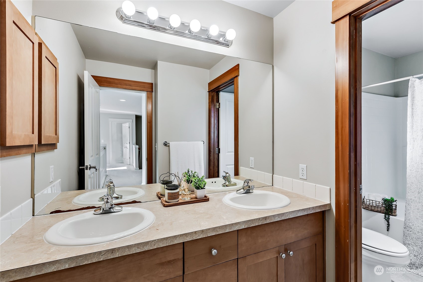 133 185th Place Southwest Bothell, WA 98012 - Photo 28 of 32 a bathroom with a sink double vanity and a toilet