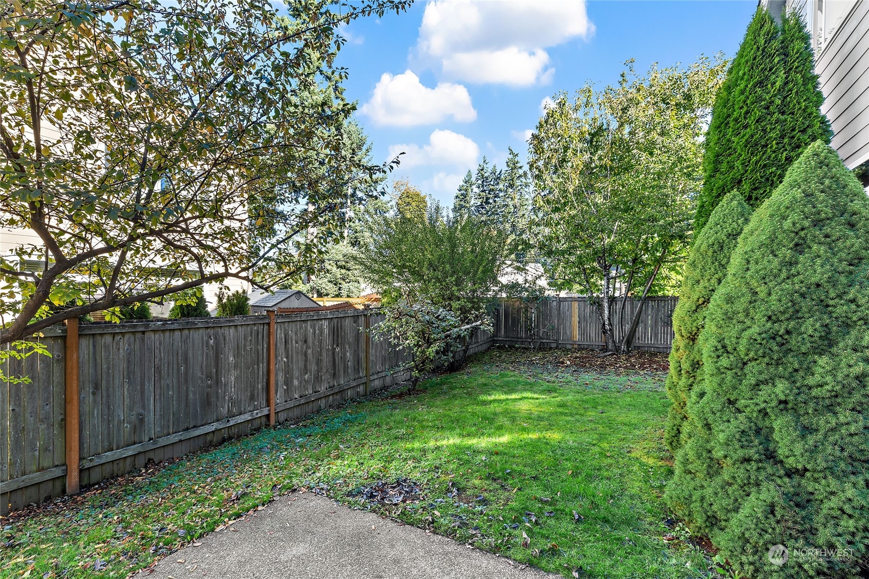 133 185th Place Southwest Bothell, WA 98012 - Photo 31 of 32 a view of a backyard with wooden fence