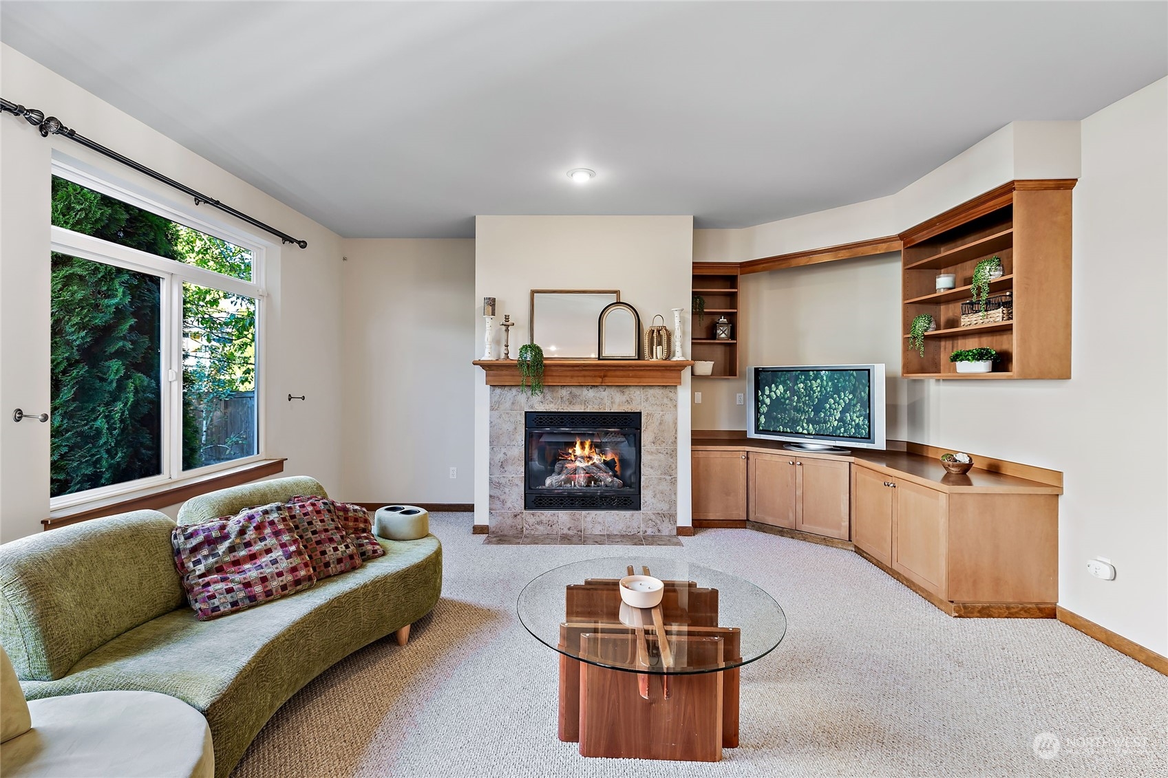 133 185th Place Southwest Bothell, WA 98012 - Photo 6 of 32 a living room with furniture and a fireplace