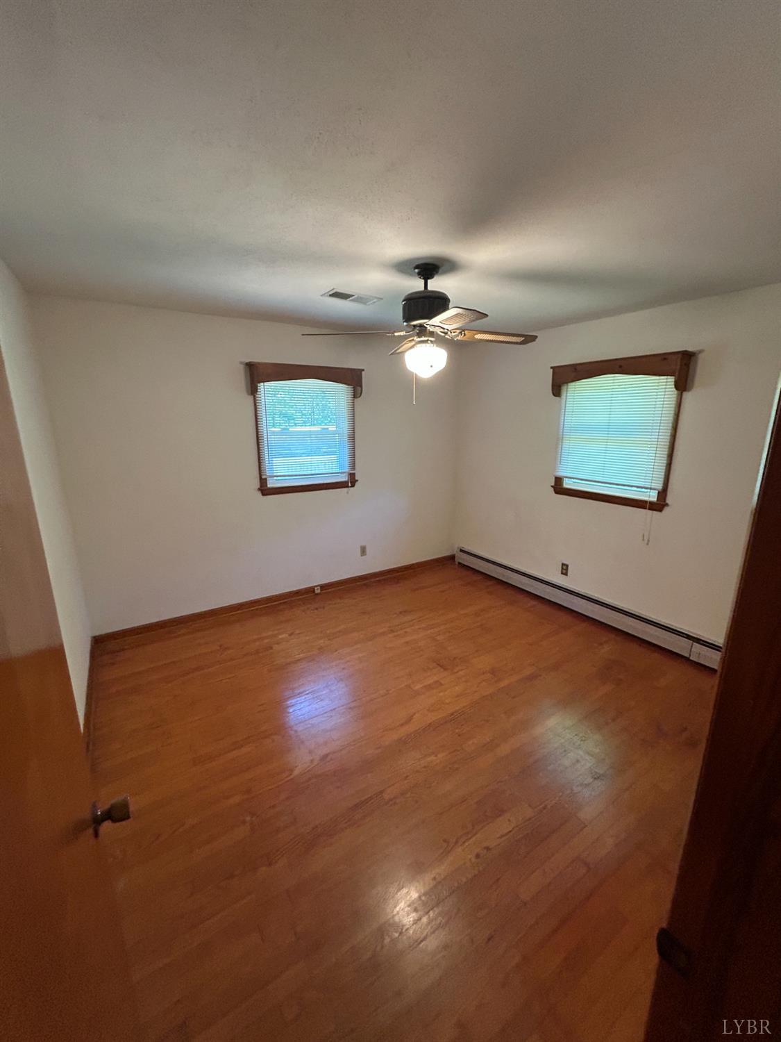 465 Wileman Road Lynch Station, VA 24571 - Photo 17 of 45 an empty room with a view of a livingroom