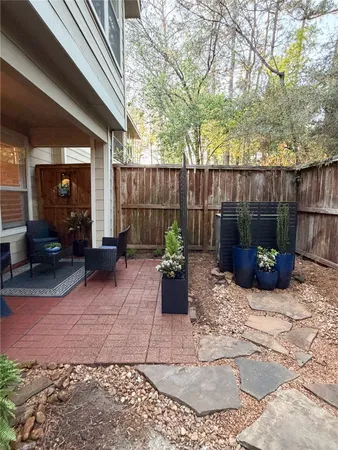 $319,500 | 158 North Magnolia Pond Place, Unit 158E, The Woodlands, TX 77381