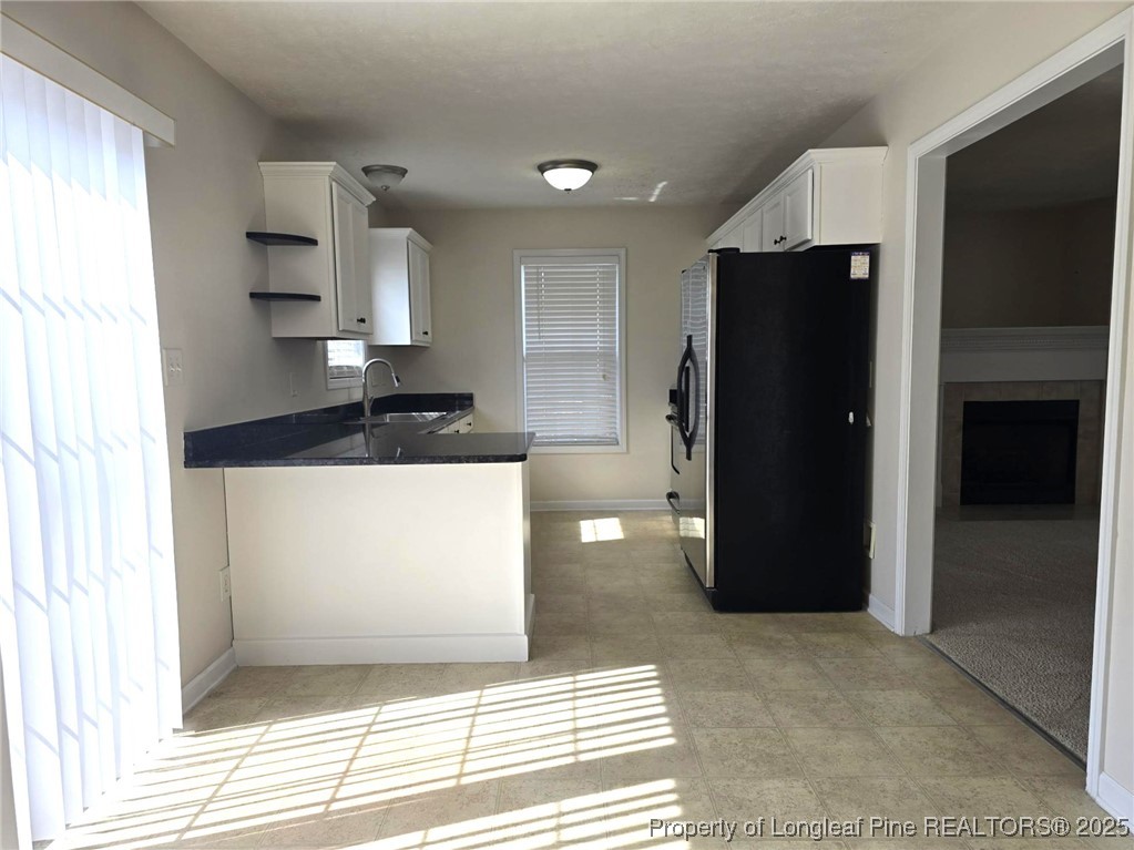 115 Haywood Street Spring Lake, NC 28390 - Photo 13 of 35 a bathroom with a sink and a mirror