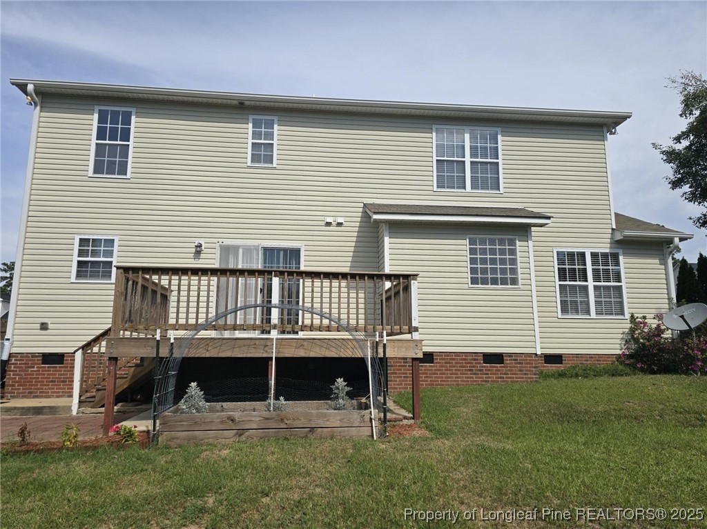 115 Haywood Street Spring Lake, NC 28390 - Photo 25 of 35 a view of a house with a backyard