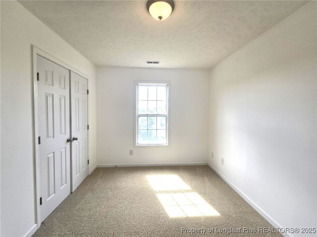 115 Haywood Street Spring Lake, NC 28390 - Photo 29 of 35 wooden floor in an empty room with a window