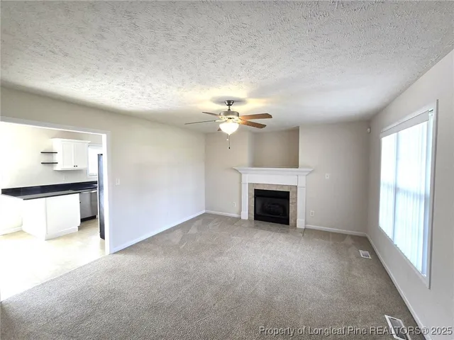 a view of a livingroom with a fireplace