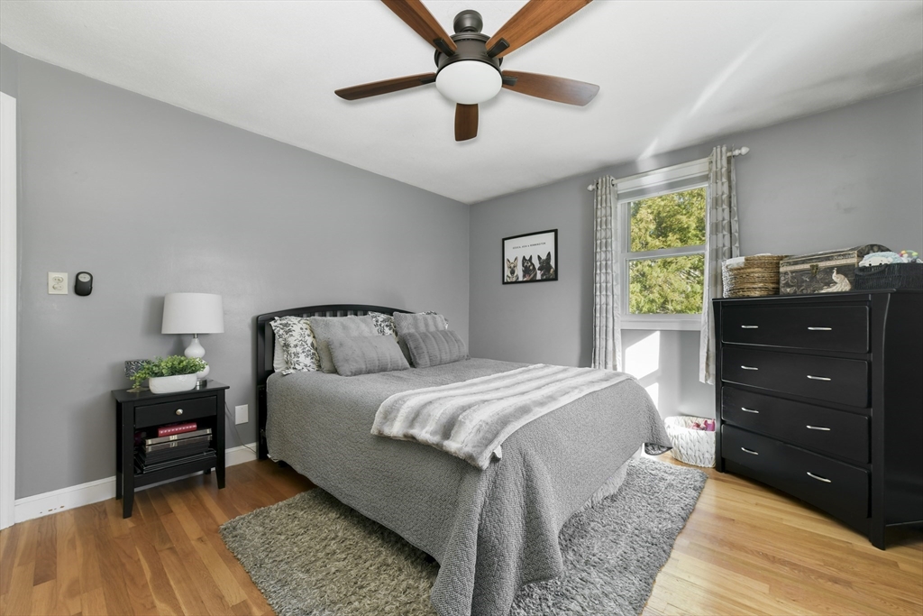 36 Taft Avenue Beverly, MA 01915 - Photo 15 of 36 a bedroom with a bed and a chandelier
