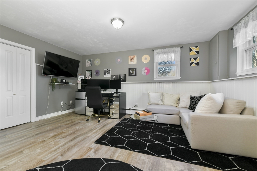 36 Taft Avenue Beverly, MA 01915 - Photo 22 of 36 a living room with furniture and a flat screen tv