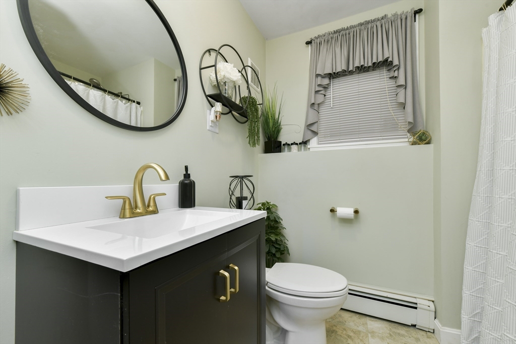 36 Taft Avenue Beverly, MA 01915 - Photo 23 of 36 a bathroom with a sink and a mirror