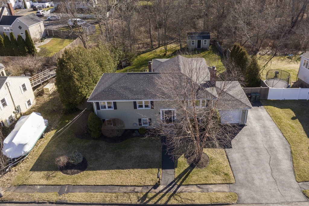 36 Taft Avenue Beverly, MA 01915 - Photo 26 of 36 an aerial view of a house with swimming pool and large trees