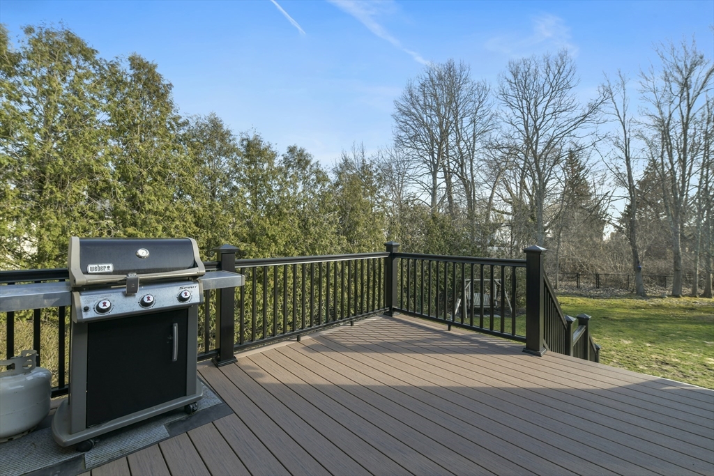 36 Taft Avenue Beverly, MA 01915 - Photo 34 of 36 a balcony with wooden floor and yard