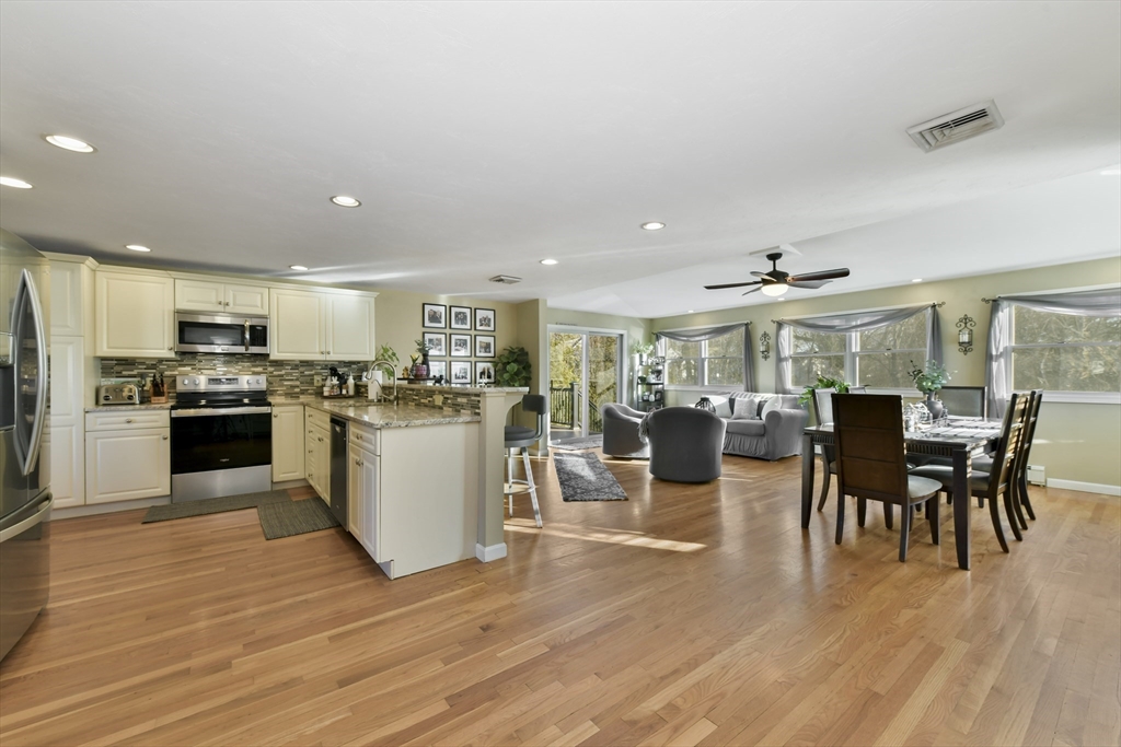 36 Taft Avenue Beverly, MA 01915 - Photo 4 of 36 a large kitchen with a table and chairs