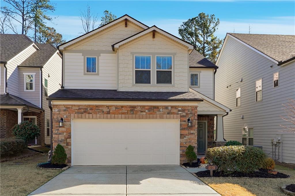 2779 Morgan Spring Trail Buford, GA 30519 - Photo 2 of 64 a view of a white house with a large windows