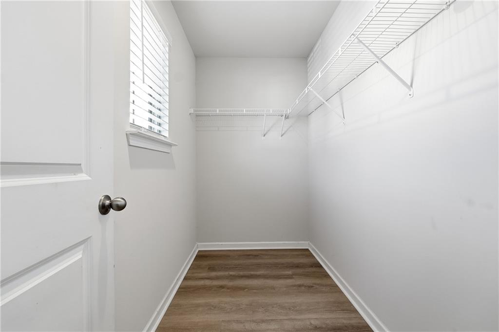 2779 Morgan Spring Trail Buford, GA 30519 - Photo 49 of 64 a view of a room with rack on the wall and a window