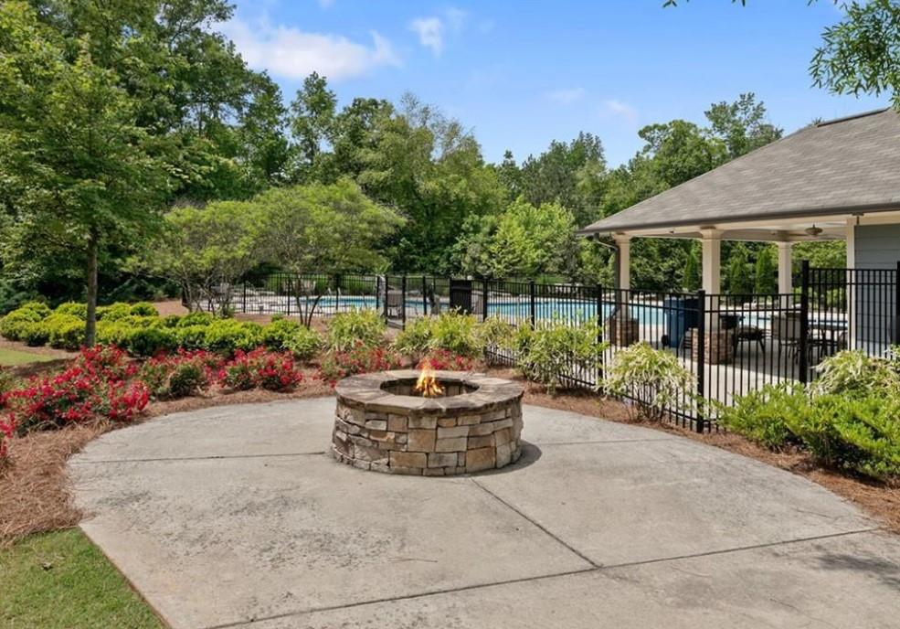 2779 Morgan Spring Trail Buford, GA 30519 - Photo 58 of 64 a view of a backyard with garden and patio