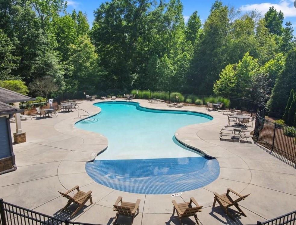 2779 Morgan Spring Trail Buford, GA 30519 - Photo 64 of 64 a view of a swimming pool and lounge chair